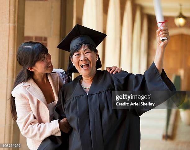 women celebrating graduation - mom cheering stock pictures, royalty-free photos & images