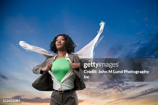 Black superhero changing clothes outdoors Black superhero changing clothes outdoors