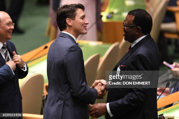 Canadian Prime Minister Justin Trudeau salutes Hage Geingob the President of the Republic of Namibia as he arrives on the floor of the United Nations...