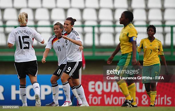 Kyra Malinowski of Germany celebrates with Lena Lotzen and Lena Pettermann during the FIFA U17 Women's World Cup match between Germany and South...