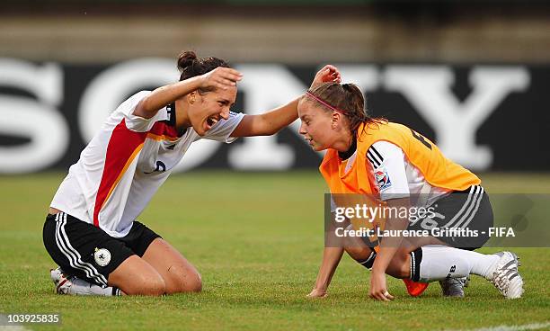 Kyra Malinowski of Germany celebrates at the end of the game with teammate Anne Rheinheimer during the FIFA U17 Women's World Cup match between...