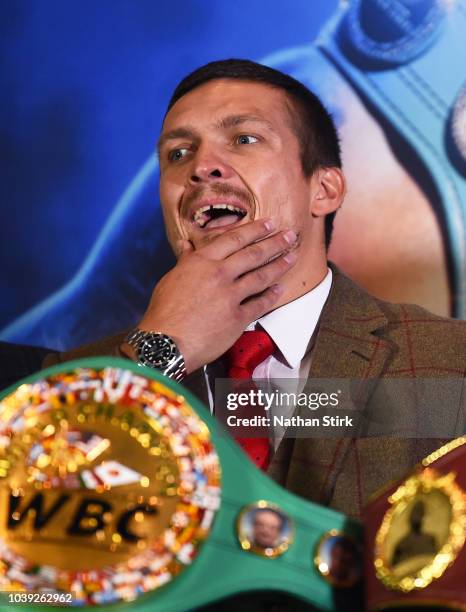 Oleksandr Usyk speaks to the media during the Oleksandr Usyk and Tony Bellew press conference at the Radisson Blu Edwardian Hotel on September 24,...