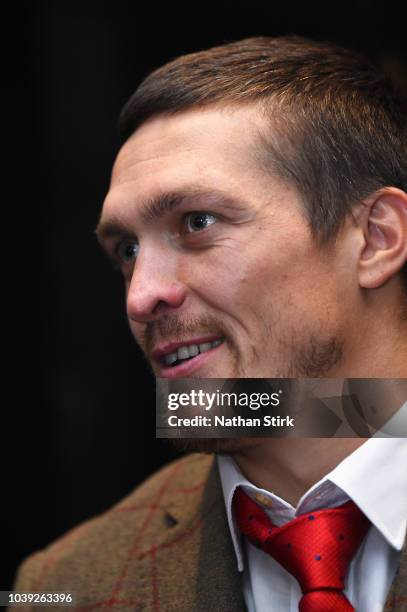 Oleksandr Usyk speaks to the media during the Oleksandr Usyk and Tony Bellew press conference at the Radisson Blu Edwardian Hotel on September 24,...