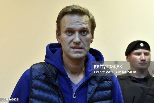 Russian opposition leader Alexei Navalny, accused of violating a protest law, attends a hearing at a court in Moscow on September 24, 2018. - Russian...