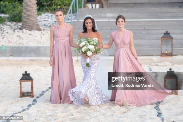 Danielle Staub with daughters Christine and Jillian walking to the alter on May 5, 2018 in Bimini, Bahamas.