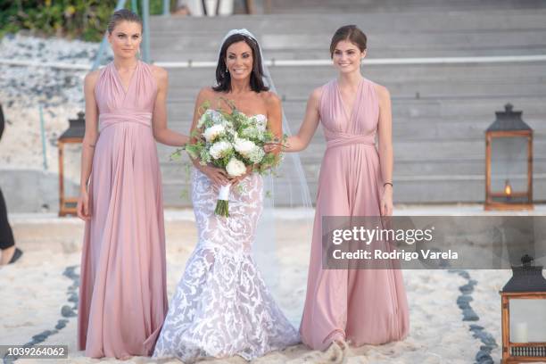 Danielle Staub with daughters Christine and Jillian walking to the alter on May 5, 2018 in Bimini, Bahamas.