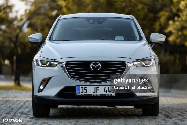 front side view of a mint condition white mazda cx-3 2017 power with leather interior parked in gaziemir district of izmir - anterior stock pictures, royalty-free photos & images