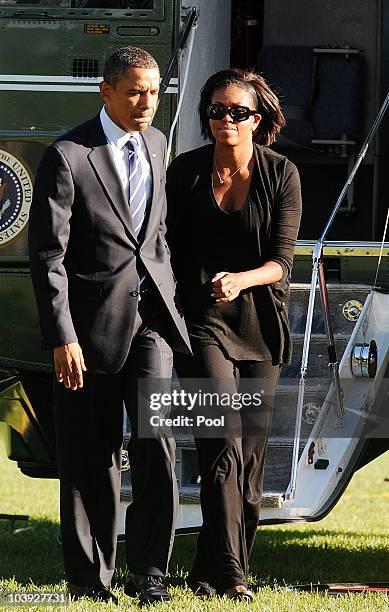 President Barack Obama and First Lady Michelle Obama arrive at the White House September 8, 2010 in Washington, DC. The President was traveling to...