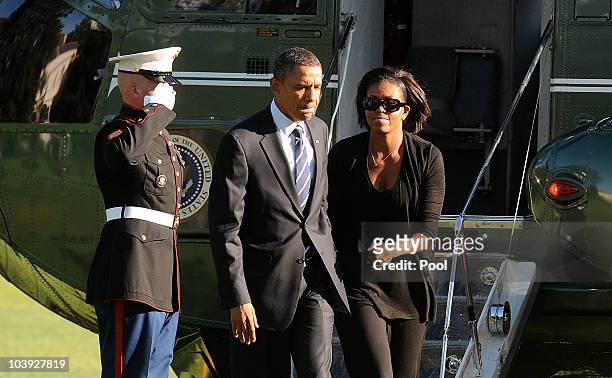 President Barack Obama and First Lady Michelle Obama arrive at the White House September 8, 2010 in Washington, DC. The President was traveling to...