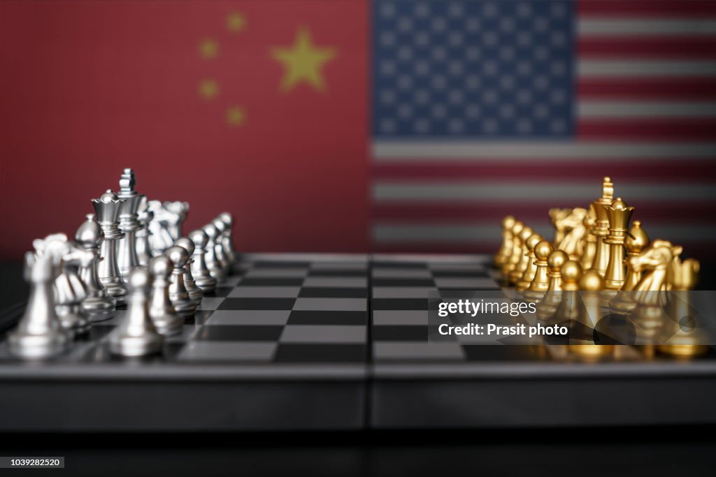Silver chess against Gold chess with USA and China flag. Design creative illustration for USA and china trade war.