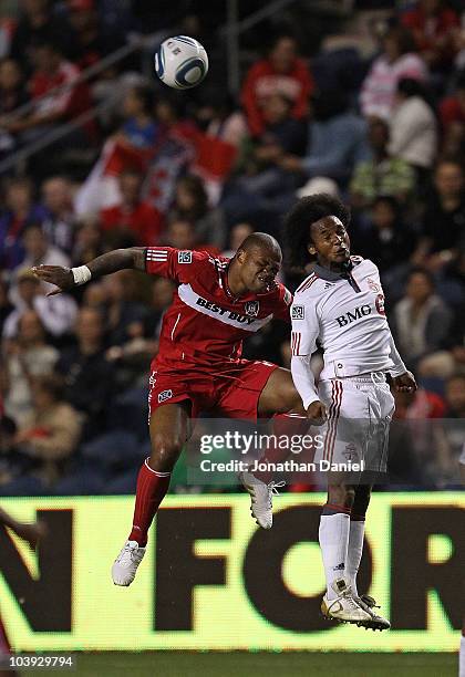 Collins John of the Chicago Fire and Julian de Guzman of Toronto FC battle for a header in an MLS match on September 8, 2010 at Toyota Park in...