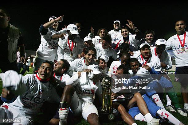 Players of Liga Desportiva Universitaria Quito celebrate victory over Estudiantes during a final match as part of the Recopa 2010 on September 8,...