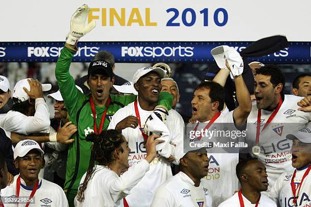 Players of Liga Desportiva Universitaria Quito celebrate victory over Estudiantes during a final match as part of the Recopa 2010 on September 8,...