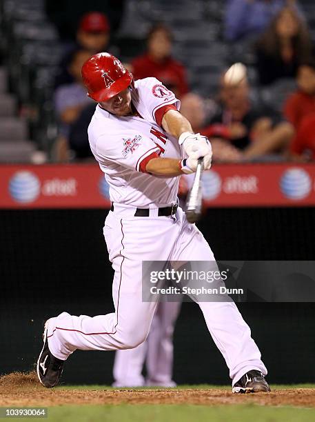 Jeff Mathis of the Los Angeles Angels of Anaheim hits a walk off sacrifice fly to score Torii Hunter form third base against the Cleveland Indians in...