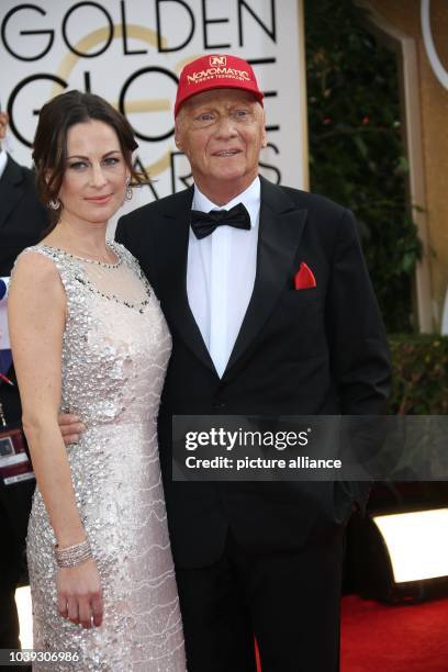 Niki Lauda and wife Birgit Wetzinger attend the 71st Annual Golden Globe Awards aka Golden Globes at Hotel Beverly Hilton in Los Angeles, USA, on 12...