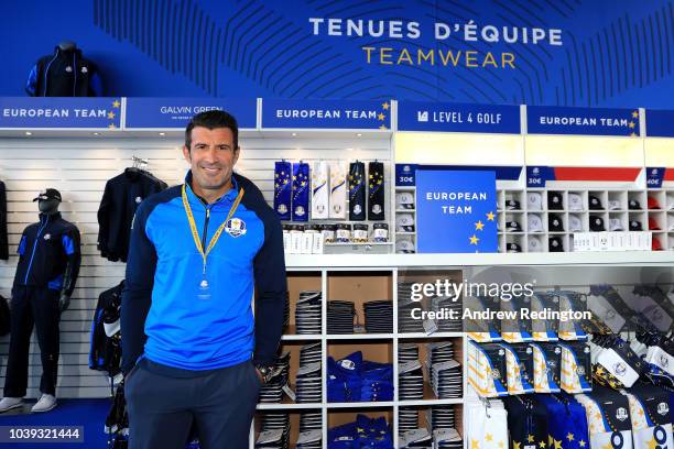 Footballer Luis Figo visits the Ryder Cup Shop in the spectator village ahead of the 42nd Ryder Cup 2018 at Le Golf National on September 24, 2018 in...