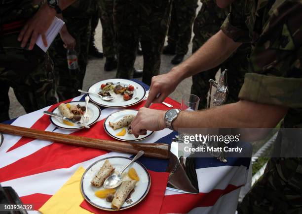 Judges taste a meal presented by army military chefs which they have just cooked in a field catering competition, at Old Cater Barracks in Bulford on...