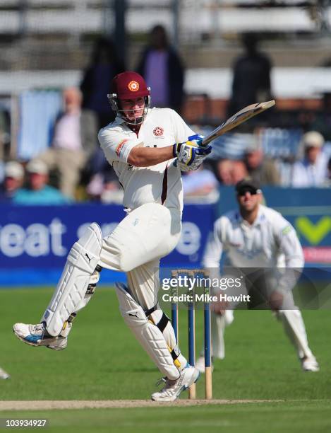 Big hitting Mal Loye of Northamptonshire hits a boundary during the LV County Championship match between Sussex and Northamptonshire at the County...