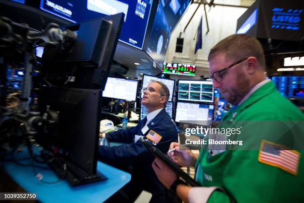 Traders work on the floor of the New York Stock Exchange in New York, U.S., on Monday, Sept. 24, 2018. U.S. Stocks fell to their lows of the day...