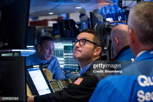 Trader works on the floor of the New York Stock Exchange in New York, U.S., on Monday, Sept. 24, 2018. U.S. Stocks fell to their lows of the day...