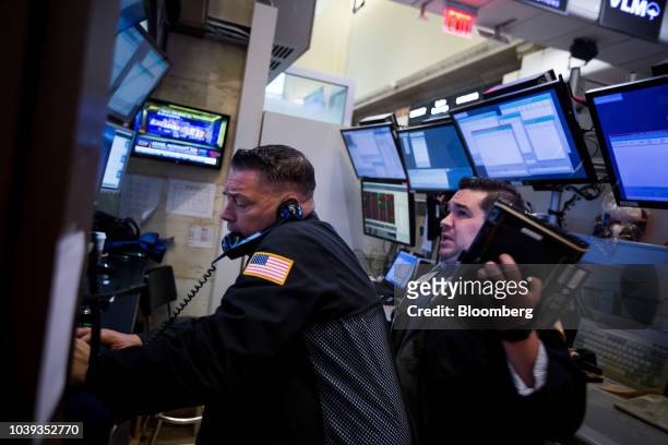 Traders work on the floor of the New York Stock Exchange in New York, U.S., on Monday, Sept. 24, 2018. U.S. Stocks fell to their lows of the day...