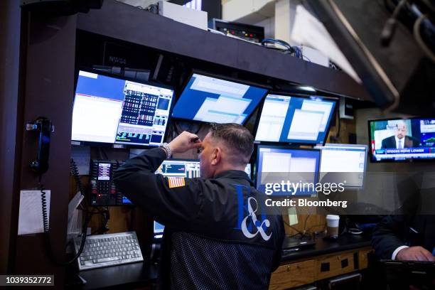 Trader works on the floor of the New York Stock Exchange in New York, U.S., on Monday, Sept. 24, 2018. U.S. Stocks fell to their lows of the day...