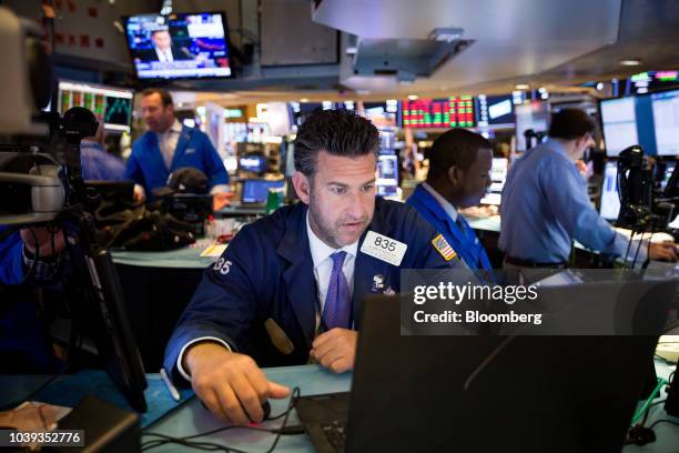 Trader works on the floor of the New York Stock Exchange in New York, U.S., on Monday, Sept. 24, 2018. U.S. Stocks fell to their lows of the day...