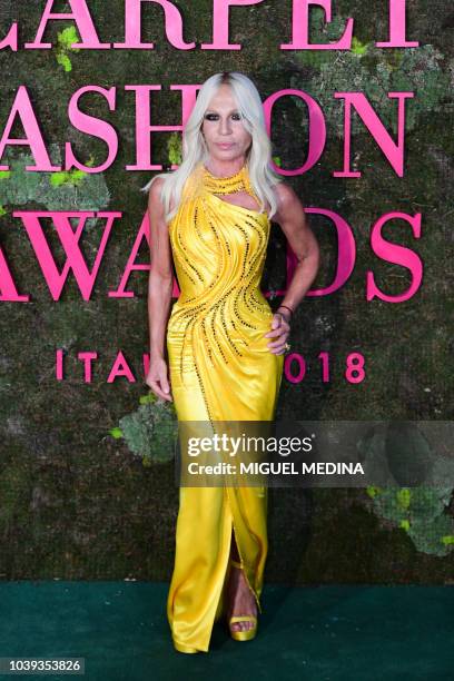 Italian fashion designer, Donatella Versace poses as she arrives to attend the Green Carpet Fashion Awards 2018, within the Women's Spring/Summer...