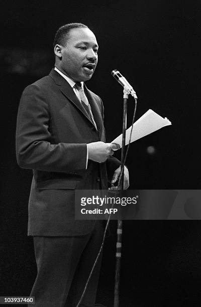 The US clergyman and civil rights leader Martin Luther King addresses, 29 March 1966 in Paris' Sport Palace the militants of the "Movement for the...