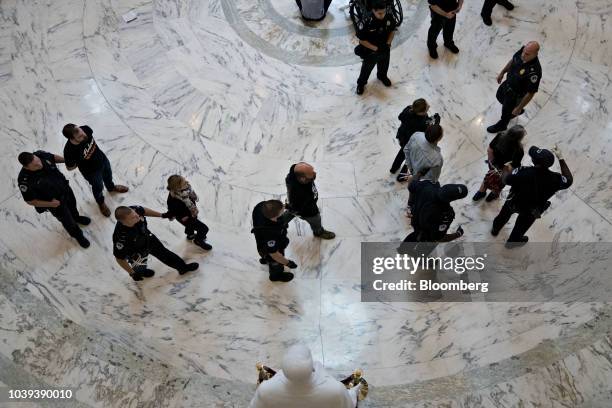 Demonstrators opposed to the Supreme Court nominee Brett Kavanaugh are detained by U.S. Capitol police in the Russell Senate Office Rotunda on...