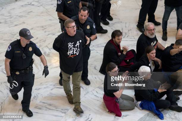 Demonstrator opposed to the Supreme Court nominee Brett Kavanaugh is detained by U.S. Capitol police in the Russell Senate Office Rotunda on Capitol...