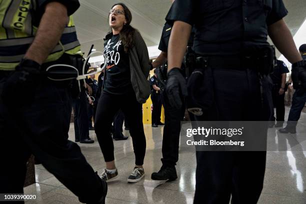 Demonstrator opposed to the Supreme Court nominee Brett Kavanaugh is detained by U.S. Capitol police near the office of Senator Susan Collins, a...