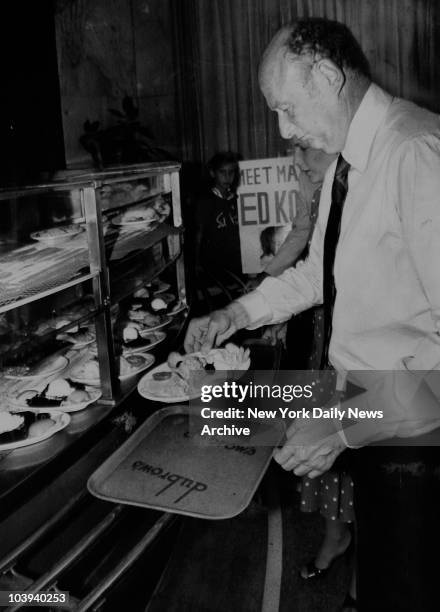 Mayor Ed Koch lunches at Dubrow's Cafeteria during campaign break. August 22 1981
