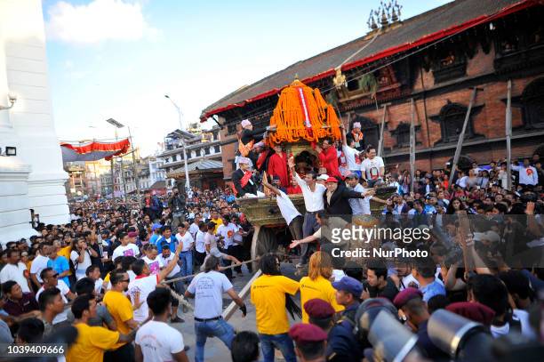 Devotees pulling the chariot of living Goddess KUMARI during Indra Jatra Festival celebrated at Basantapur Durbar Square, Kathmandu, Nepal on Monday,...