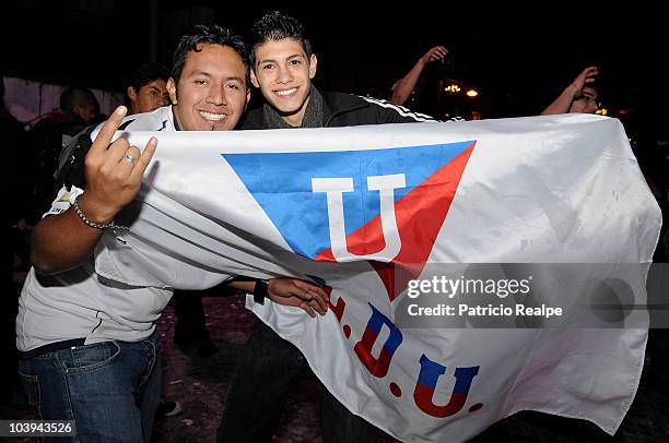 Supporters of Liga Desportiva Universitaria Quito celebrate victory over Estudiantes on the streets of Quito after a final match as part of the...