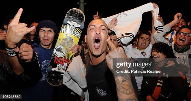 Supporters of Liga Desportiva Universitaria Quito celebrate victory over Estudiantes on the streets of Quito after a final match as part of the...