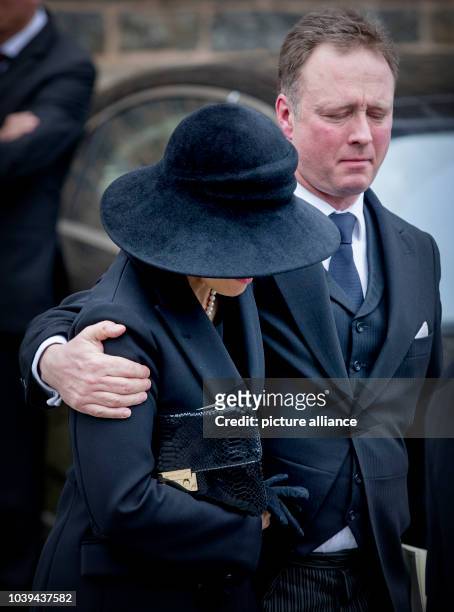 Prince Gustav and Carina Axelsson attend the funeral service of Prince Richard zu Sayn-Wittgenstein-Berleburg at the Evangelische Stadtkirche in Bad...