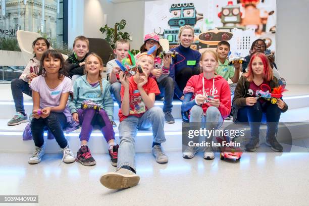 Former German swim olympic gold medalist Britta Steffen the Arche kids during the kids workshop 'Driven by Kids' hosted by Volkswagen AG at DRIVE...