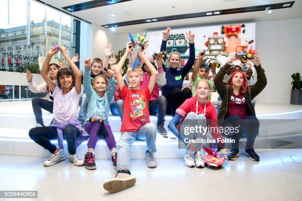 Former German swim olympic gold medalist Britta Steffen the Arche kids during the kids workshop 'Driven by Kids' hosted by Volkswagen AG at DRIVE...