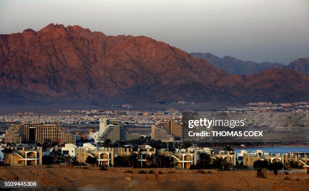 General view ahows the Israeli Red Sea resort city of Eilat and the Jordanian city of Aqaba in the background, on September 24, 2018.