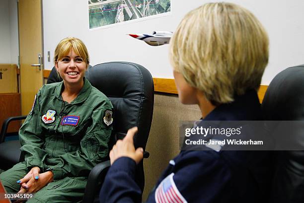 Paula Creamer , 2010 Women's US Open Champion, goes over flight procedures with Kristin "Mother" Hubbard before flying in an F-16 with the U.S. Air...