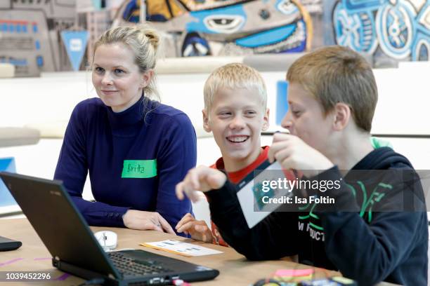 Former German swim olympic gold medalist Britta Steffen and Arche kids during the kids workshop 'Driven by Kids' hosted by Volkswagen AG at DRIVE...