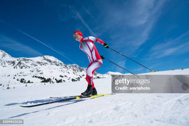 nordic cross country skier in race suit skating - nordic skiing event stock pictures, royalty-free photos & images