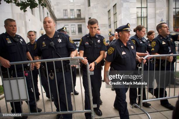 Sheriffs move a barricade as Bill Cosby departs in his SUV outside he Montgomery County Courthouse on the first day of sentencing in his sexual...