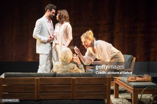 Renato Schuch , Stephanie Eidt , Lore Stefanek and Nina Hoss perform on stage during the photo rehearsal of the play 'Bella Figura' in the theatre at...