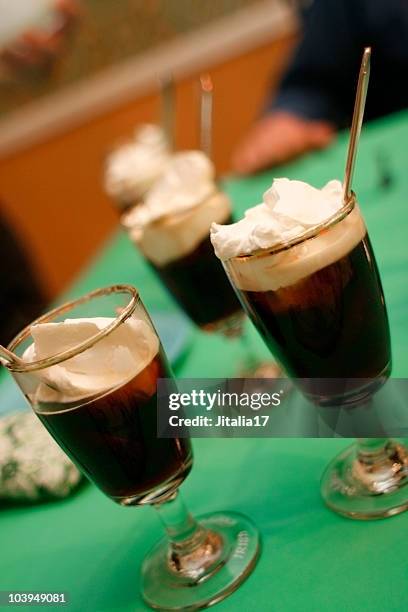 irish coffees with whipped cream - on green tablecloth - irish culture stock pictures, royalty-free photos & images