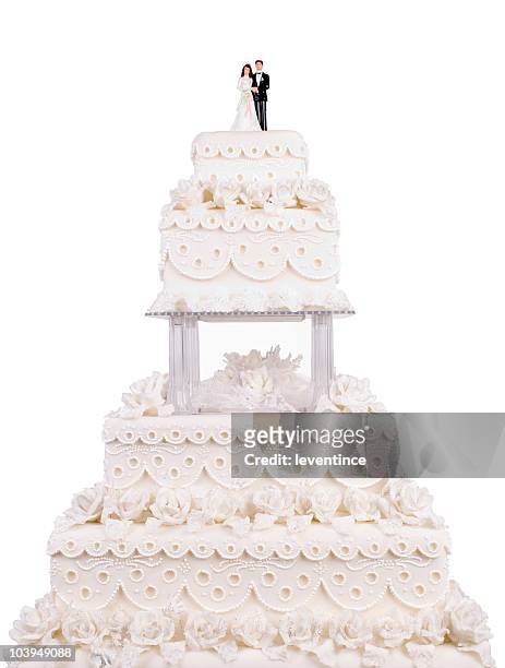 two tier wedding cake with plastic couple on top - cake isolated stockfoto's en -beelden