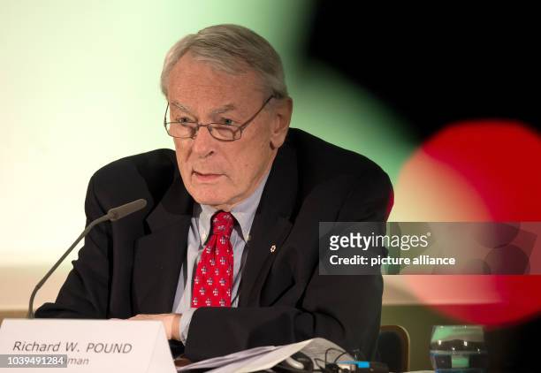 Richard Pound, head of the independent commission of the World Anti-Doping Agency , sitting at the podium during a press conference in...