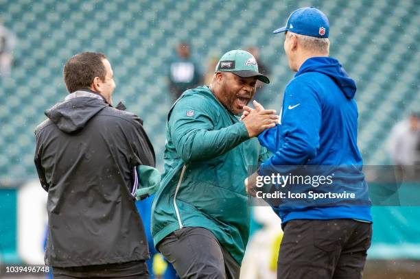 Philadelphia Eagles running backs coach Duce Stalet greets Indianapolis Colts head coach Frank Reich during pregame of the National Football League...