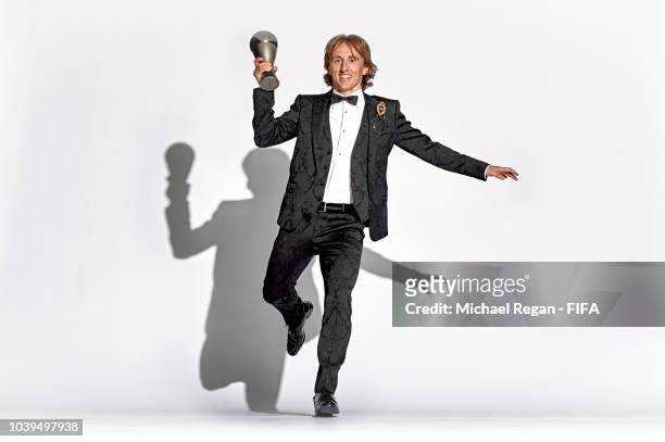 Luka Modric of Croatia and Real Madrid pose for a picture with his The Best FIFA Men's Player Award during The Best FIFA Football Awards at Royal...